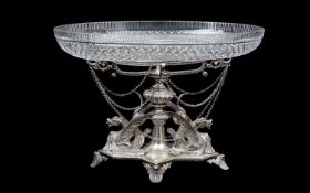 A 19TH CENTURY SILVER PLATED AND CUT GLASS CENTREPIECE