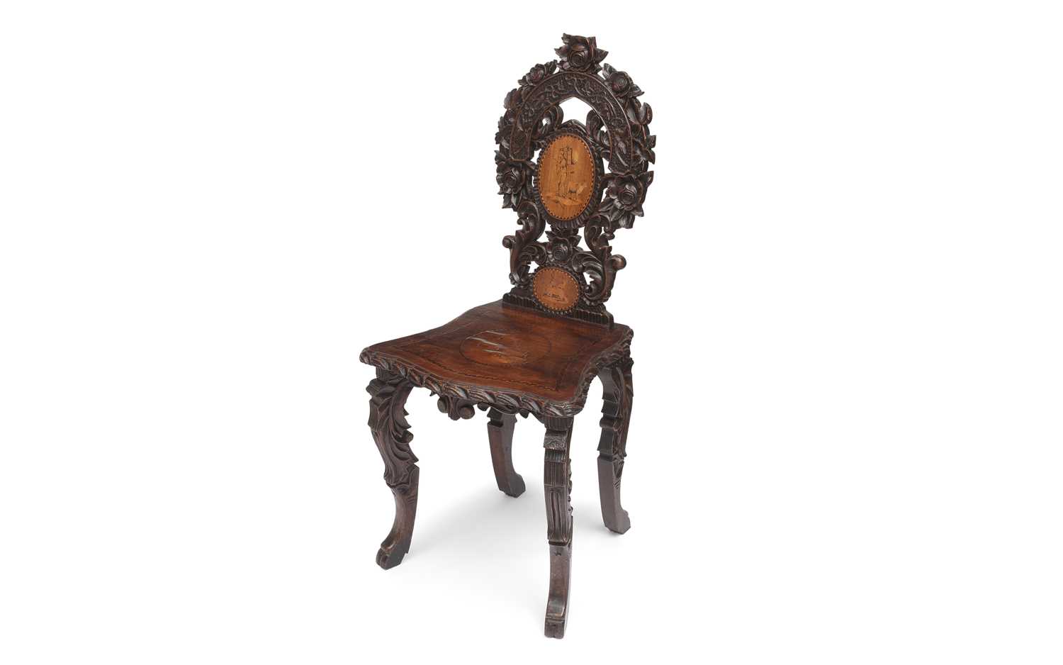 A LATE 19TH CENTURY BLACK FOREST CARVED WOOD HALL CHAIR