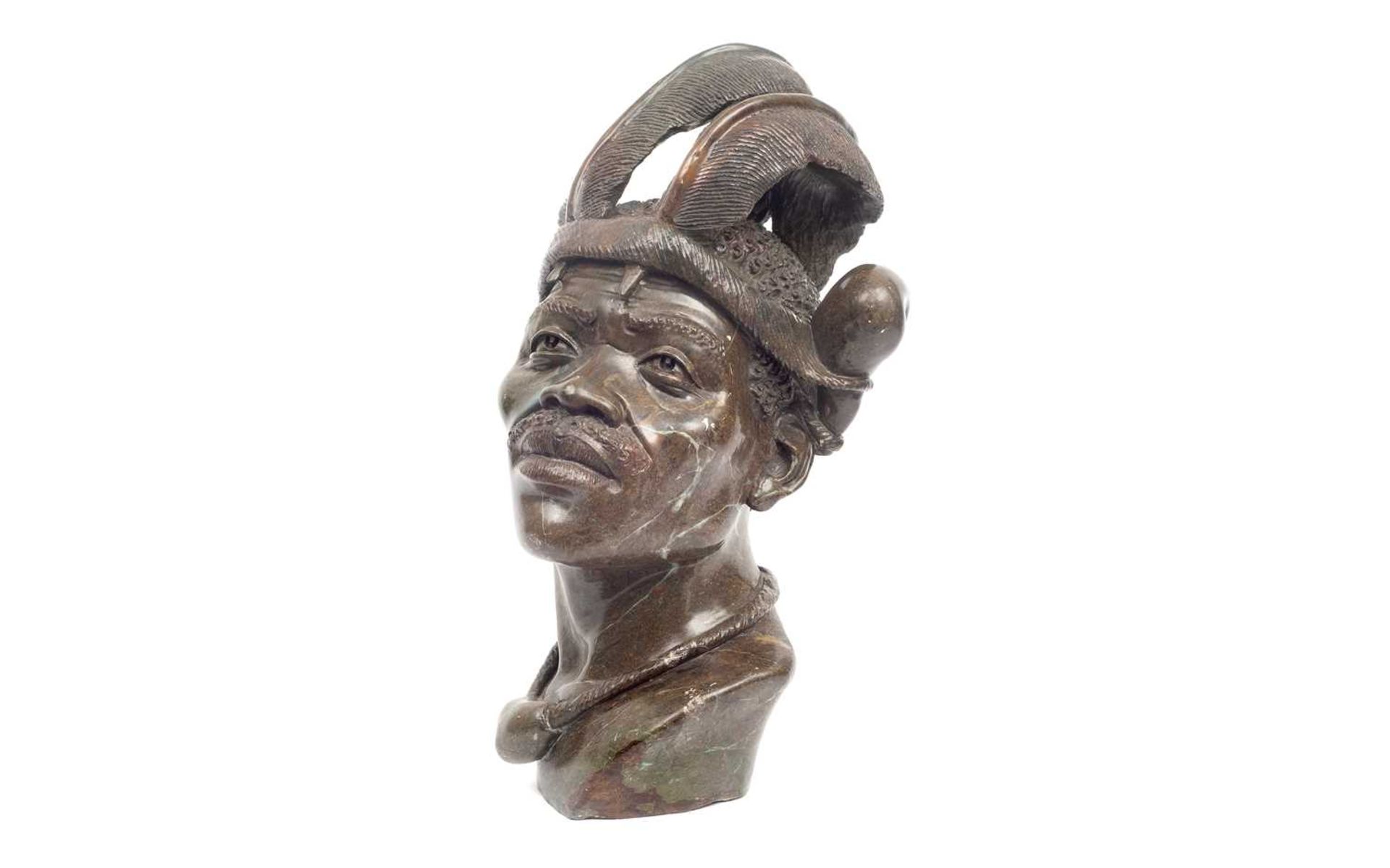 A 20TH CENTURY CARVED HARDSTONE PORTRAIT OF AN AFRICAN MAN