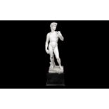 A LARGE 19TH CENTURY ITALIAN MARBLE FIGURE OF DAVID AFTER MICHELANGELO