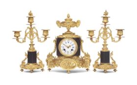 A 19TH CENTURY PATINATED AND GILT BRONZE MANTEL CLOCK SET