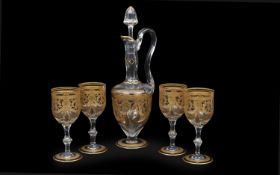 A ST LOUIS, PARIS CRYSTAL GLASS AND GILT DECORATED DECANTER WITH FOUR GLASSES