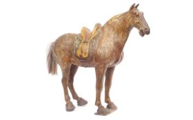 A TANG DYNASTY STYLE GLAZED POTTERY HORSE