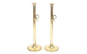 A LARGE PAIR OF 19TH CENTURY BRASS EJECTOR CANDLESTICKS