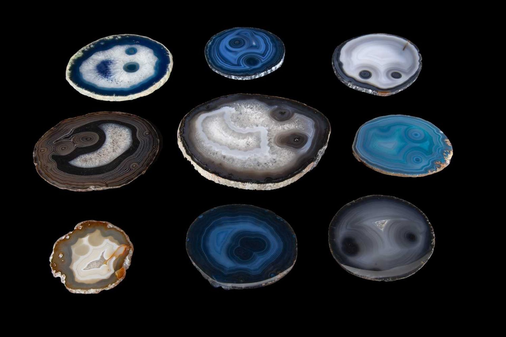 NINE SLICES OF AGATE RESEMBLING HUMAN FACES