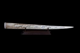 A CARVED SWORDFISH (XIPHIAS GLADIUS) BILL ON WOODEN DISPLAY STAND