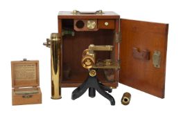 A 19TH CENTURY BRASS MICROSCOPE WITH SLIDES AND BOX