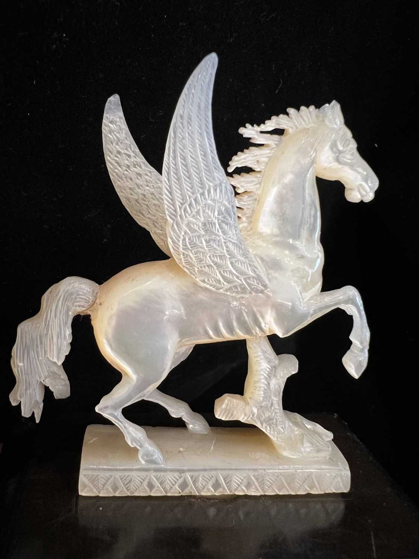 A 19TH CENTURY CARVED MOTHER OF PEARL MODEL OF A PEGASUS