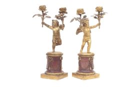 A PAIR OF 19TH CENTURY FRENCH GILT BRONZE AND MARBLE CHERUB CANDELABRA