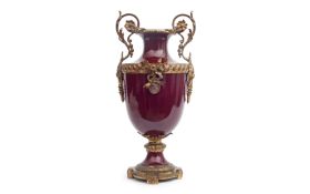 AN EARLY 20TH CENTURY LOUIS XVI STYLE RED GLAZED PORCELAIN VASE