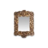 A MID 18TH CENTURY GERMAN ROCOCO GILTWOOD WALL MIRROR