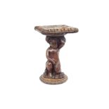 A LATE 19TH CENTURY ITALIAN WALNUT STAND CARVED WITH A PUTTO