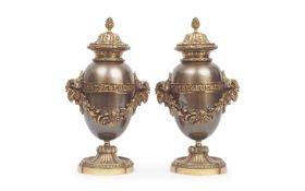 A PAIR OF NEO-CLASSICAL STYLE GILT METAL URNS