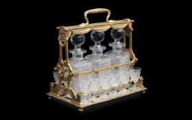 ATTRIBUTED TO BACCARAT: A LATE 19TH CENTURY GILT BRONZE AND GLASS TANTALUS