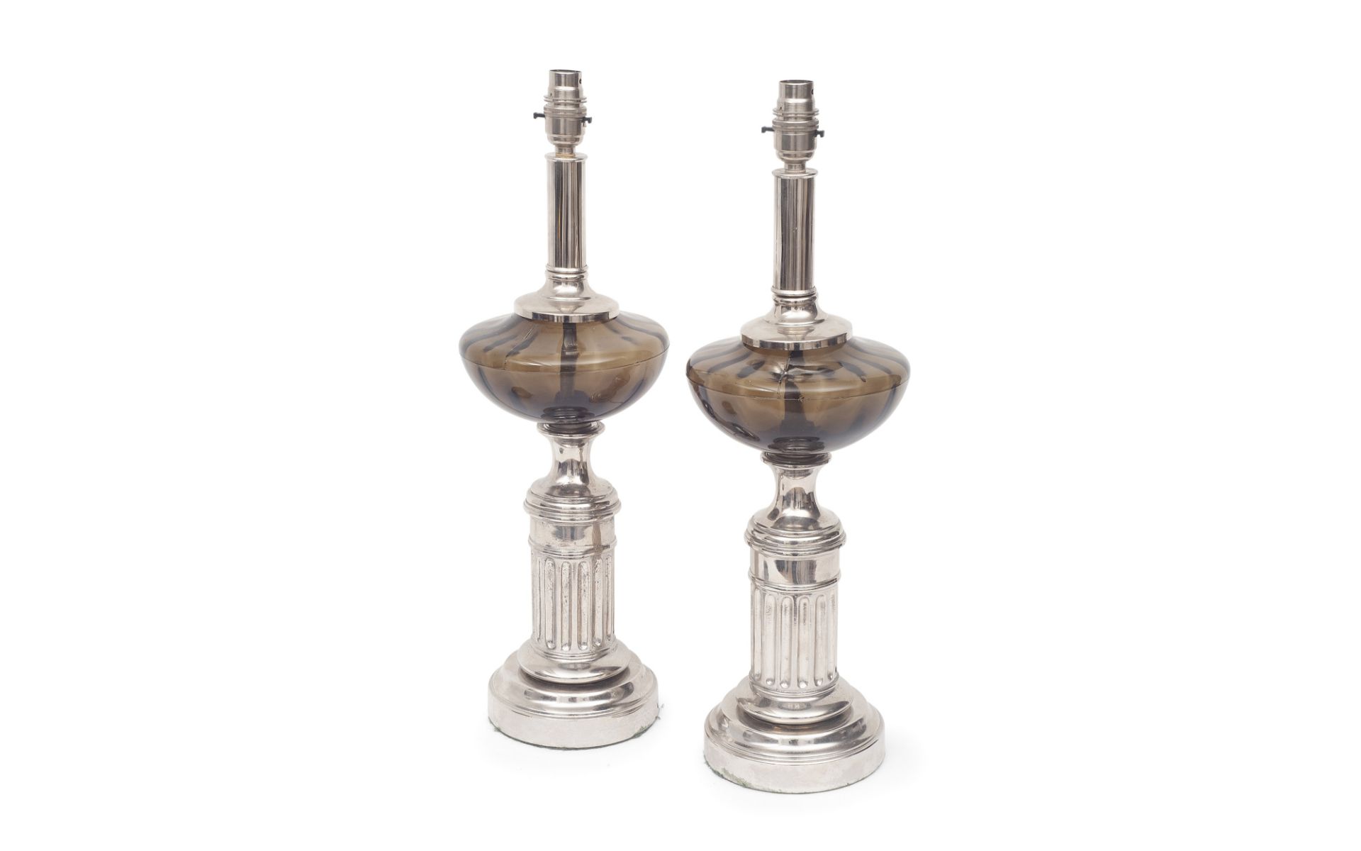 A PAIR OF NICKEL PLATED AND SMOKED GLASS LAMP BASES