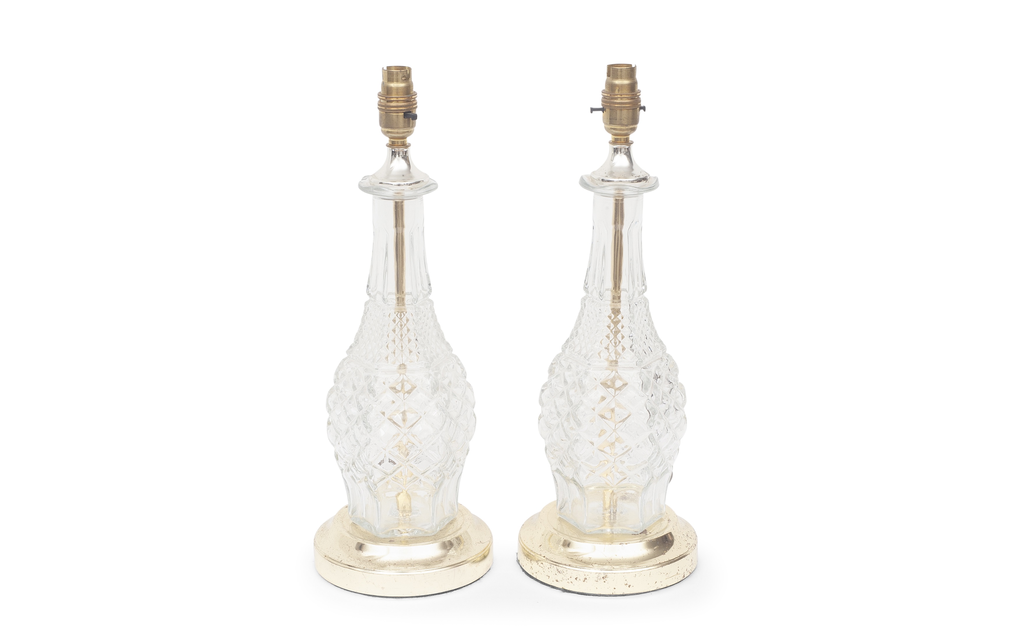 A PAIR OF FRENCH MOULDED GLASS AND PARCEL GILT LAMP BASES