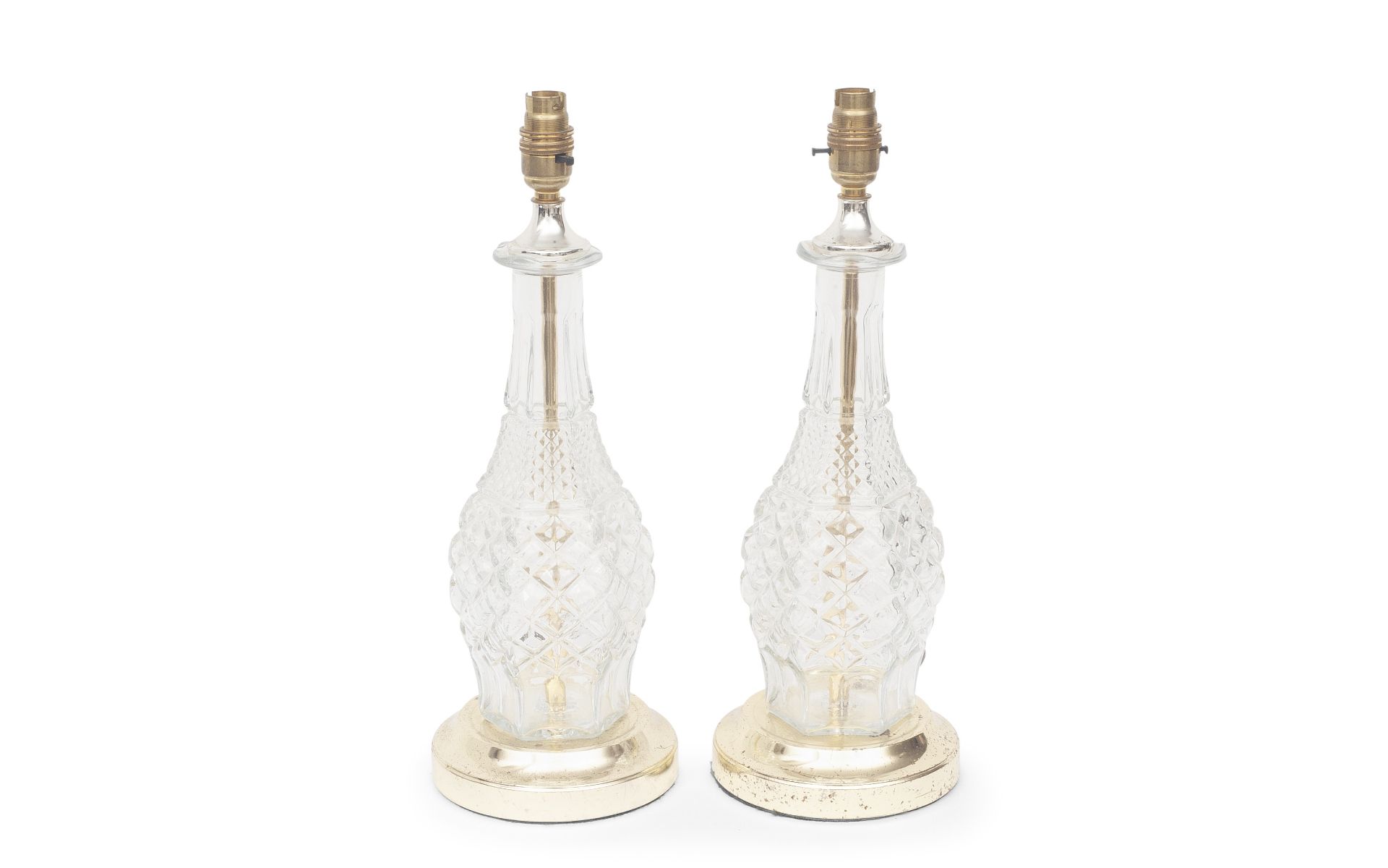 A PAIR OF FRENCH MOULDED GLASS AND PARCEL GILT LAMP BASES