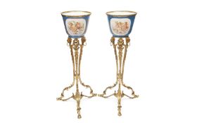 A PAIR OF EARLY 20TH CENTURY SEVRES STYLE PORCELAIN JARDINIERES ON STANDS