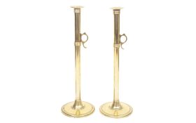 A LARGE PAIR OF 19TH CENTURY BRASS EJECTOR CANDLESTICKS