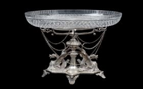 A 19TH CENTURY SILVER PLATED AND CUT GLASS CENTREPIECE