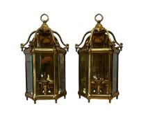 A PAIR OF REGENCY STYLE BRASS HALL LANTERNS