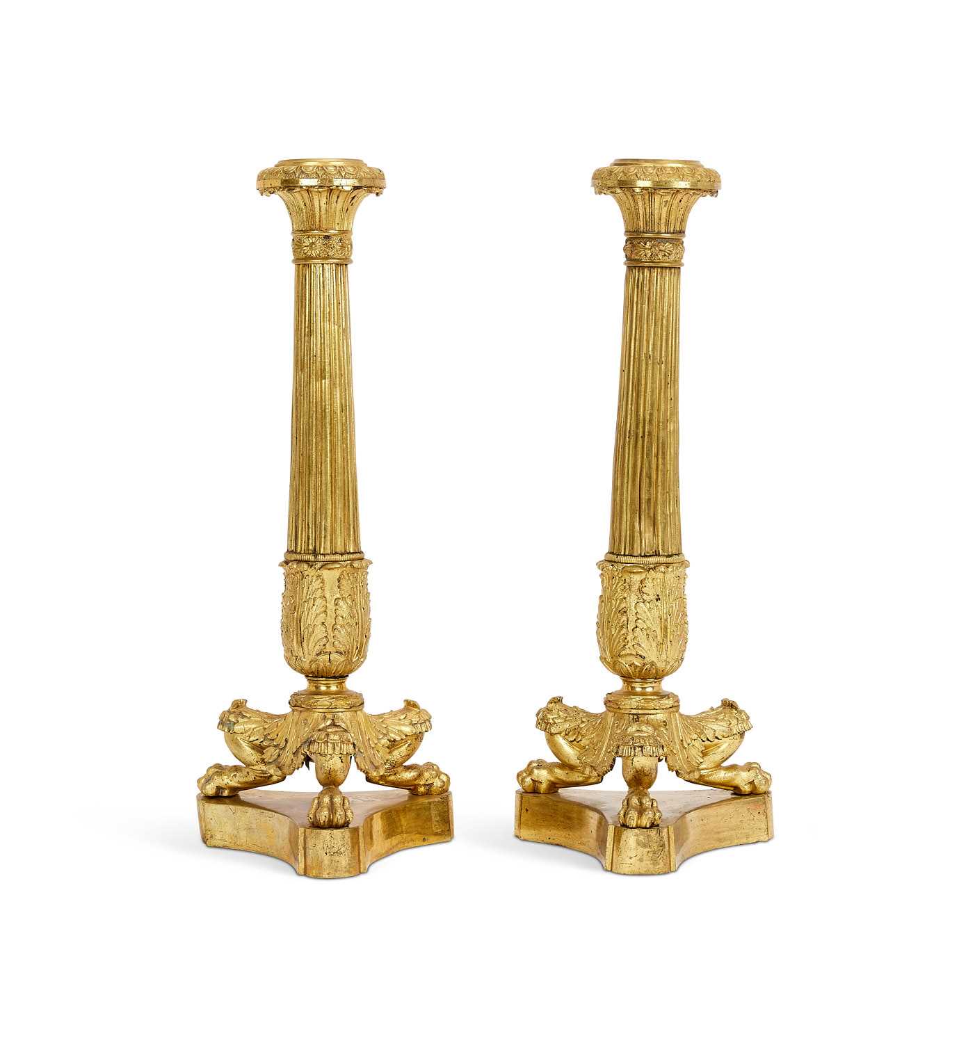 A PAIR OF EARLY 19TH CENTURY FRENCH GILT BRONZE CANDLESTICKS