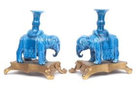 A PAIR OF 19TH CENTURY CHINESE QING DYNASTY TURQUOISE GLAZED ELEPHANT CANDLESTICKS