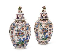 A PAIR OF EARLY 18TH CENTURY DUTCH DELFT VASES AND COVERS