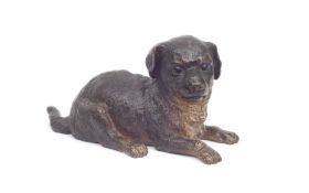 A LATE 19TH CENTURY COLD PAINTED BRONZE MODEL OF A PUPPY