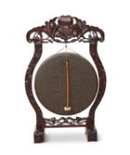 AN EARLY 20TH CENTURY CHINESE HARDWOOD GONG
