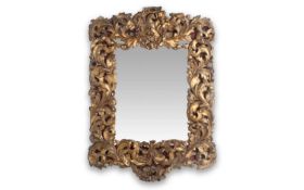 A MID 18TH CENTURY GERMAN ROCOCO GILTWOOD WALL MIRROR