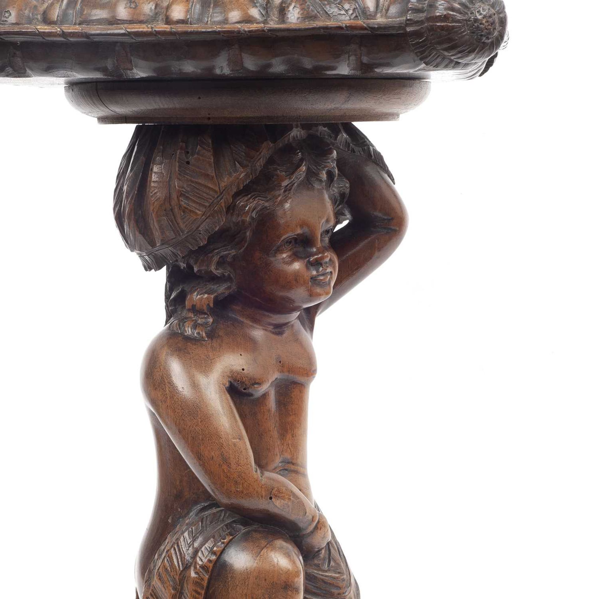 A LATE 19TH CENTURY ITALIAN WALNUT STAND CARVED WITH A PUTTO - Image 3 of 3