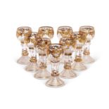 A FINE SET OF NINE 20TH CENTURY GILDED GLASS GOBLETS