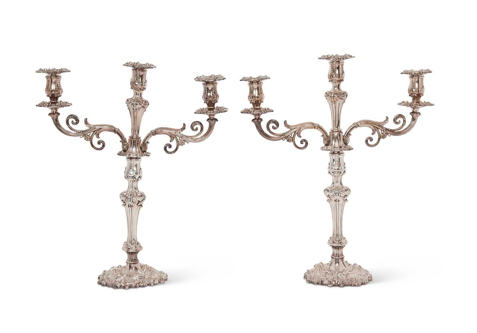 A PAIR OF EARLY 19TH CENTURY OLD SHEFFIELD PLATE CANDELABRA AFTER THE DESIGN BY PAUL STORR