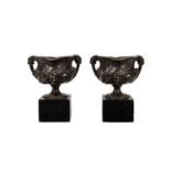 A PAIR OF SMALL 19TH CENTURY GRAND TOUR TYPE BRONZE URNS