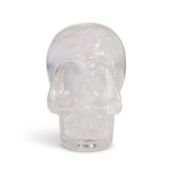 A SOLID CARVED ROCK CRYSTAL MODEL OF A HUMAN SKULL