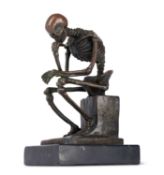 A BRONZE MEMENTO MORI OF A HUMAN SKELETON 'THE THINKER'