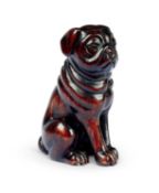 A CARVED HARDWOOD NETSUKE OF A PUG DOG