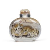 A CHINESE REVERSE GLASS PAINTED SNUFF BOTTLE DECORATED WITH A TIGER