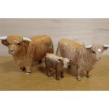 A TRIO OF BESWICK HIGHLAND CATTLE