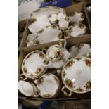 TWO TRAYS OF ROYAL ALBERT OLD COUNTRY ROSES CHINA TO INCLUDE A TEAPOT, TUREENS, CUPS AND SAUCERS