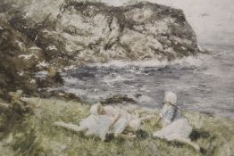 ROBERT GEMMELL HUTCHINSON (1860-1936). A rocky coastal scene with young girls resting, 'When the