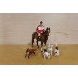 A BESWICK HUNTING SCENE CONSISTING OF A HUNTSMAN ON HORSEBACK, THREE HOUNDS AND A FOX (5) HORSE