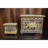 TWO CARVED WOODEN LIDDED STORAGE BOXES WITH HAND PAINTED DETAIL