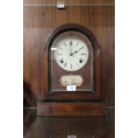 A NINETEENTH CENTURY ROSEWOOD AMERICAN MANTEL CLOCK, the domed case opening from the front, key