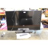 A SAMSUNG 32" FLATSCREEN TV - REMOTE / INSTRUCTIONS / HOUSE CLEARANCE