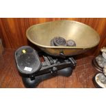 A LARGE CAST METAL SET OF SCALES AND WEIGHTS