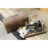 A CASED VINTAGE GERMAN MADE HAND PAINTED SEWING MACHINE