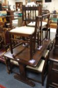 AN ERCOL STYLE DRAWLEAF OAK TABLE WITH SIX CHAIRS AND ONE EXTRA ARMCHAIR