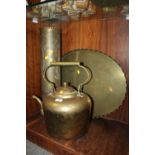 A LARGE BRASS KETTLE TOGETHER WITH A TALL BRASS STICK STAND AND A BRASS CHARGER (3)